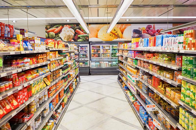 Image of Supermarket aisle worker
